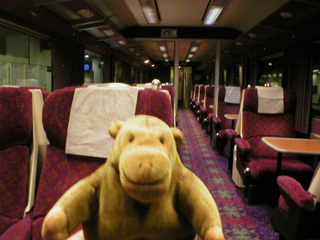 Mr Monkey inside a old style railway carriage