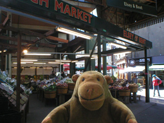 Mr Monkey in front of Elsey and Bent in Borough Market