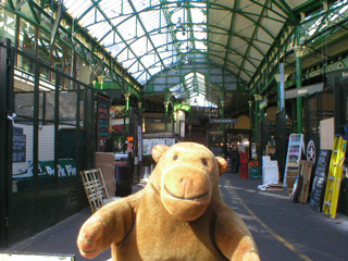 Mr Monkey striding through Borough Market