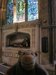 Mr Monkey looking at the monument to William Shakespeare