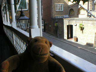Mr Monkey looking down from a gallery at the George Inn