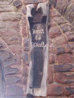 The oak coffin fixed into the wall of Saint John's