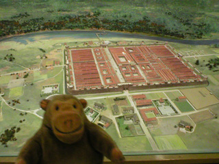 Mr Monkey in front of a model of Roman Chester