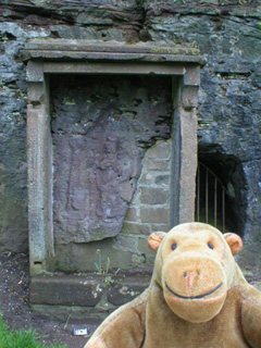 Mr Monkey looking at a shrine to Minerva