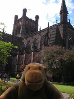 Mr Monkey walking past Chester Cathedral