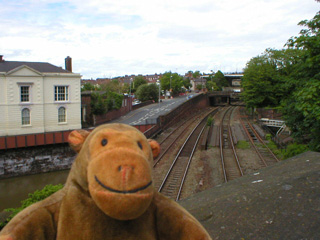 Mr Monkey looking at railway lines under Chester's walls