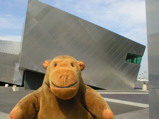 Mr Monkey looking at the Water Shard of the Imperial War Museum North