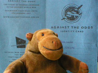 Mr Monkey in front of his Against The Odds identity card