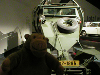 Mr Monkey in front of a Leopard IV security vehicle