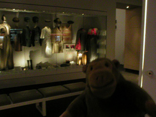 Mr Monkey looking at a display case in Silo 2