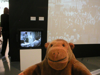 Mr Monkey watching Coronation Street and old film of Manchester