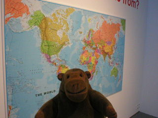Mr Monkey looking at a map of the world