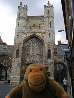 Mr Monkey looking at Monk Bar from Monkgate