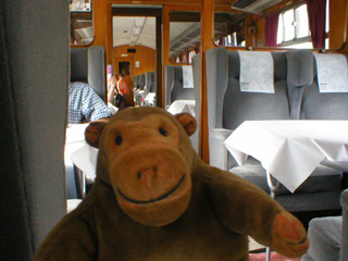 Mr Monkey looking at a train at Leeds station