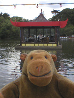 Mr Monkey looking at a organ floating on Peasholm Park lake