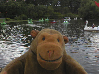 Mr Monkey watching people boating on Peasholm Park lake