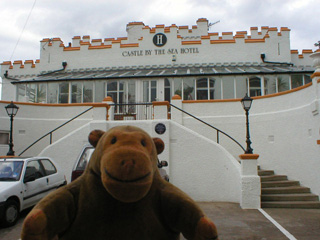 Mr Monkey outside the Castle by the Sea hotel