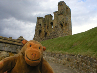 Mr Monkey looking back at the keep from the entrance to the castle