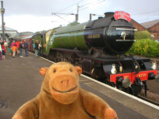 Mr Monkey examining the Green Arrow at York station