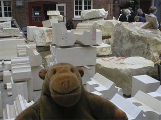 Mr Monkey looking partially worked stone blocks