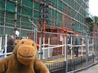 Mr Monkey looking at the lift on the front of the Minster