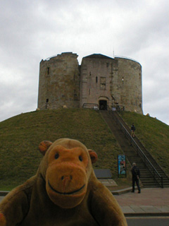 Mr Monkey looking up at Clifford's Tower