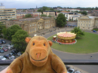 Mr Monkey looking at the York Castle museum from Clifford's Tower