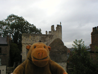 Mr Monkey walking away from Micklegate Bar