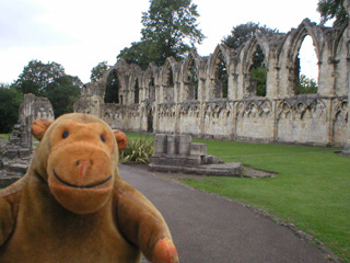 Mr Monkey looking at the ruins of St Mary's Priory