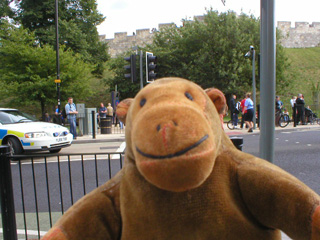 Mr Monkey looking a police car and people outside York station