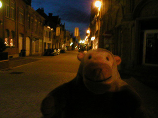 Mr Monkey walking the streets of Nieuwpoort in the dark