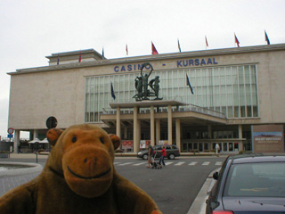 Mr Monkey looking at the front of the Casino-Kursaal