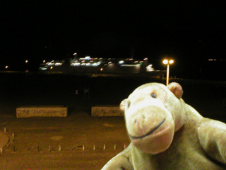 Mr Monkey watching a ferry leaving Ostende