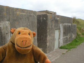 Mr Monkey walking along the wall towards Robin Hood's tower