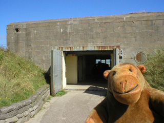 Mr Monkey looking into a Regelbau R612 flanking bunker