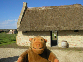 Mr Monkey looking at the smoking and baking house