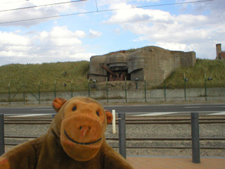 Mr Monkey looking at an R671 bunker from the street