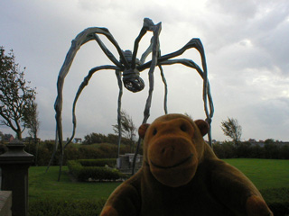 Mr Monkey looking at Maman looming over the grave of James Ensor