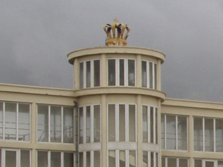 A racecourse stand with a crown on top