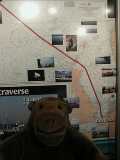 Mr Monkey looking at a map showing the Amandine's route to Iceland