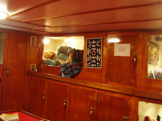 A crewman trying to sleep aboard the Amandine