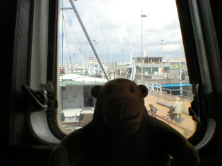 Mr Monkey looking out of the window of the bridge