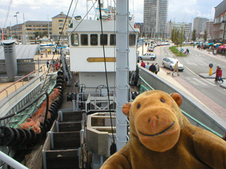 Mr Monkey looking at the deck from the prow of the Amandine