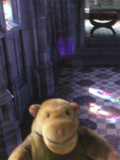 Mr Monkey in the passage to the chapel behind the main altar