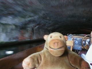 Mr Monkey going into a tunnel on a boat