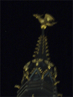 The dragon on top of the Belfry after dark
