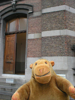 Mr Monkey looking at the bows of a trawler in dry dock