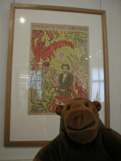 Mr Monkey in front of a poster by Ensor