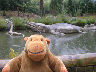 Mr Monkey looking at an Ichthyosaurus creeping up on a Plesiosaurus