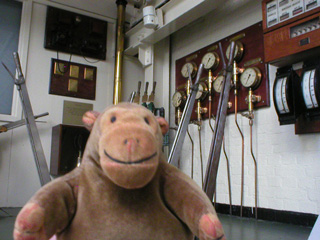 Mr Monkey looking at the old controls of Tower Bridge